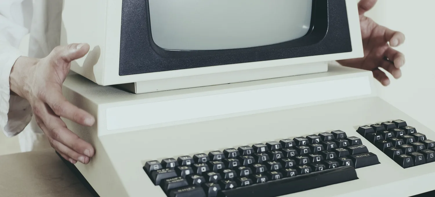 A beige CRT workstation — the kind of console our first NLHE bot rig ran on in 2017.